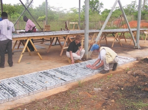 Midlands Minerals president and CEO, Kim Harris, examines core samples at one of the company's properties in Ghana.