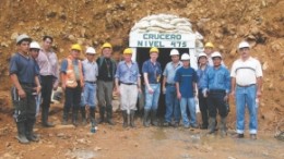 Mine staff pose outside a portal at International Minerals' Gaby gold property, located 130 km south of Guayaquil, Ecuador.