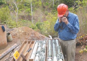 Geologist Marcus Waring inspects core samples at Luna Gold's Aurizona gold project in Brazil.