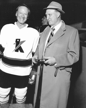 Teck Terrific and former Teck president and CEO, Norman B. Keevil Sr., strikes a pose with Flin Flon prospector, Lew Parres.