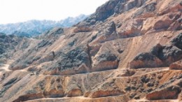 A drill rig is dwarfed in the road on the Gazelle zone at Centamin Egypt's Sukari project, in Egypt.