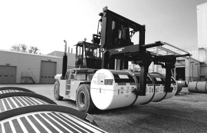 A forklift loads a uranium hexafluoride (UF6) cylinder for shipping at Cameco's Port Hope, Ont., plant. The company's supplier of hydrofluoric acid has terminated its contract, leaving Cameco without the key ingredient needed to make UF6.