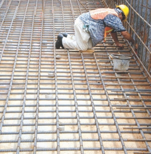 A worker lays the foundations for the mill at Infinito Gold's Crucitas gold project in Costa Rica. Environmental concerns at the project have forced the company to stop construction.