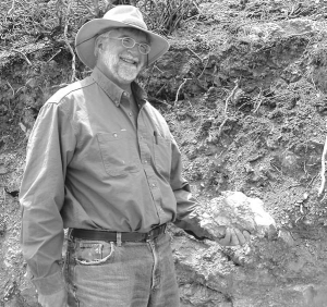 Warren Thompson, Fronteer Development Group's senior exploration geologist, points to a showing of mineralization at the company's 51%-owned Long Canyon gold project in Elko Cty., Nev.