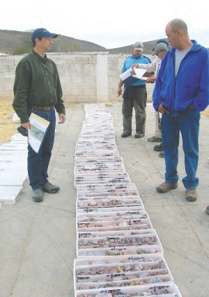 John-Mark Staude, president and CEO of Riverside Resources (left), stands over drill core from the El Capitan gold target, part of the company's Penoles property in Mexico.