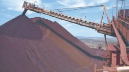 Stacking iron ore onto blending stockpile at Rio Tinto's Yandicoogina mine, in Western Australia. Rio has announced a deal with BHP Billiton that will see the two companies combine all current and future iron ore operations in Western Australia, while retaining separate marketing arms.