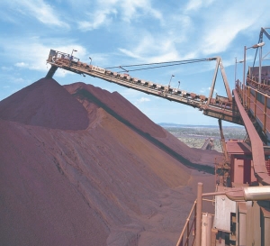 Stacking iron ore onto blending stockpile at Rio Tinto's Yandicoogina mine, in Western Australia. Rio has announced a deal with BHP Billiton that will see the two companies combine all current and future iron ore operations in Western Australia, while retaining separate marketing arms.