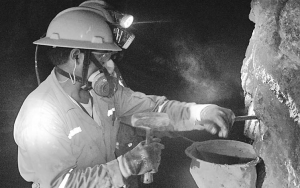 A worker chips away samples at Iberian Minerals' Condestable copper-gold-silver project in Peru.