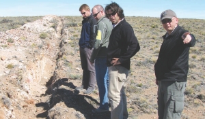 Argentex Mining president and CEO Ken Hicks (right) and chief geological consultant Diego Guido (second from right) examine trenching efforts with site visitors at the company's Pinguino silver-gold-lead-indium project in Santa Cruz province, Argentina.