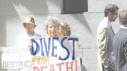 Protestors organize outside a hotel in downtown Toronto while Goldcorp holds its annual shareholder meeting.