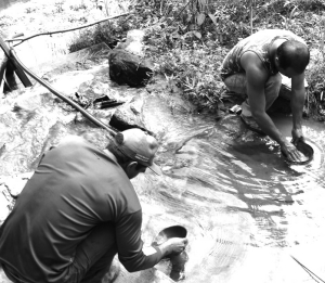 Artisanal miners pan for gold at Magellan Minerals' Coringa gold project in Brazil's Amazon basin.