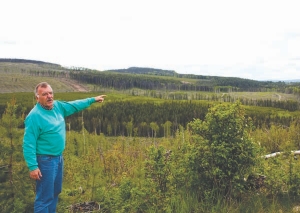 Tom Schroeter, president of Fjordland Exploration, points to the promising Southeast zone at the Woodjam copper-gold-molybdenum project, near Horsefly, B.C.