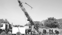 Drillers and their rig in action at Volta Resources' Gaoua copper-gold project in southwestern Burkina Faso.