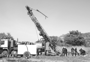 Drillers and their rig in action at Volta Resources' Gaoua copper-gold project in southwestern Burkina Faso.