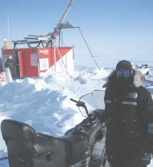 Geologist Nicole Lasanen stands in front of a drill on hole 21 at the Llama Lake Zone at Sabina Gold & Silver's Back River project in southwest Nunavut.