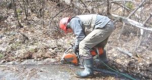 A worker cuts out a channel sample from the Kipawa deposit at Matamec Exploration's Zeus REE project in Quebec.