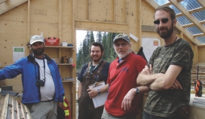 Head of mineral services for the Yukon Geological Survey, Mike Burke (far left), and Atac Resources' president Rob Carne (second from right), with members of the exploration team in the core shack at the Rau gold project.