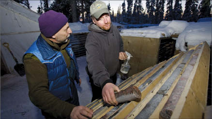 From left: geologists Chris Pederson and Martin Heiligmann inspecting core at Avalon Rare Metals' Nechalacho rare-earth project in Thor Lake, N.W.T. Photo by Avalon Rare Metals
