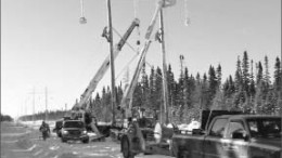 Workers construct a power line at Detour Gold's Detour Lake project in northern Ontario. Photo by Detour Gold