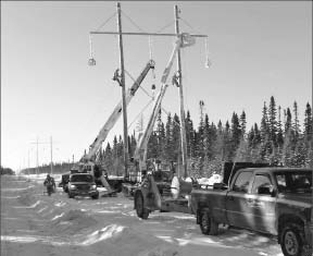 Workers construct a power line at Detour Gold's Detour Lake project in northern Ontario. Photo by Detour Gold