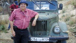 Geologist Ricardo Valls leans on a Soviet-era vehicle at Caldera Resources' Marjan gold-silver project in southern Armenia. Photo by Caldera Resources