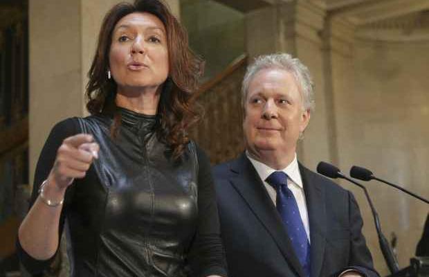 Nathalie Normandeau and Quebec Premier Jean Charest at her resignation press conference.