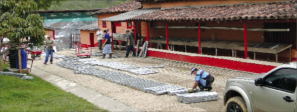 Staff log core in the camp at Bellhaven Copper & Gold's La Mina gold-copper porphyry project in central Colombia. Photo by Bellhaven Copper & Gold