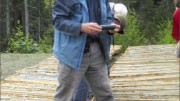 First Point Minerals president Peter Bradshaw looks at awaruite core at the Decar project in central British Columbia. Photo by Matthew Allan