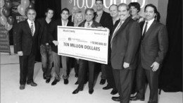 The Bharti family and colleagues present a $10-million cheque to Dominic Giroux, president and vice-chancellor of Laurentian University. Pictured, front row, from left: Tito Bharti (brother); Andr Bharti (son); Julian Bharti (son); Hannele Bharti (wife); Stan Bharti; Dominic Giroux; and Perry Dellelce. Photo by Laurentian University