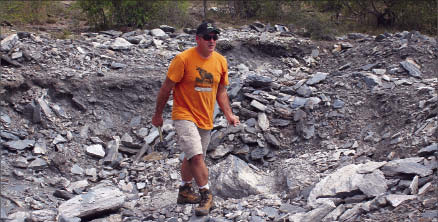 Energizer Resources' senior VP of operations Craig Scherba walks on a giant graphite ridge on the Seta graphite zone at the Green Giant vanadium-graphite project in Madagascar. Photo by Energizer Resources