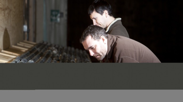 Exploration geologists Rory Krocker (front) and Adam Larsen examine core at Treasury Metals' Goliath project. Photo by Treasury Metals