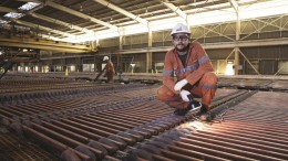 Examining cathode at BHP Billiton's Olympic Dam copper-uranium-gold mine and mill in South Australia. Photo by BHP Billiton