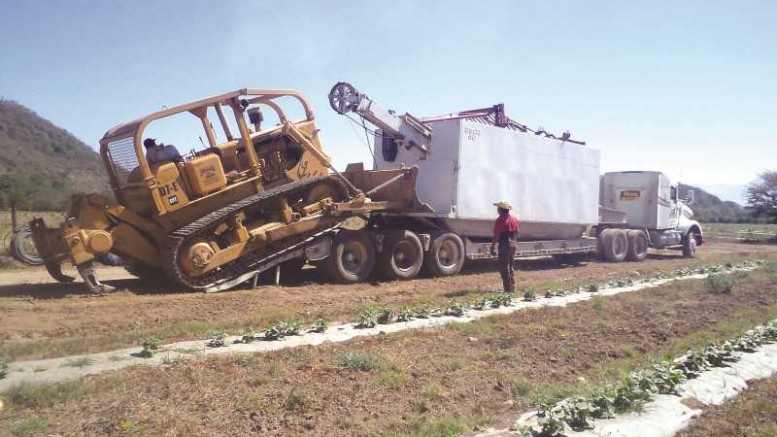 A drill rig and bulldozer arrive at Riverside Resources and Cliffs Natural Resources' Huerta project in Jalisco, Mexico. Photo by Riverside Resources