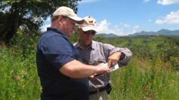 Soltoro CEO Andrew Thomson (left) and an investor look at a map at the El Rayo silver project in Mexico. Photo by Trish Saywell