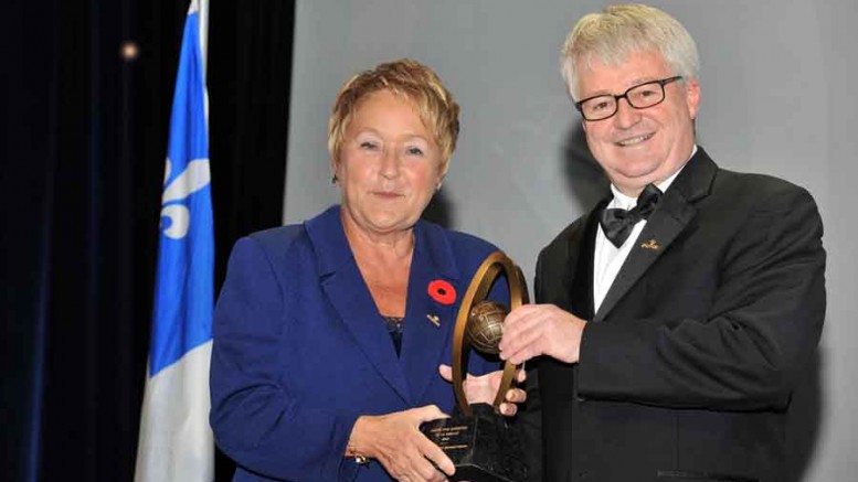 Fordia president Luc Paquet receives the Grand Prix from Quebec Premier Pauline Marois. Source: Fordia