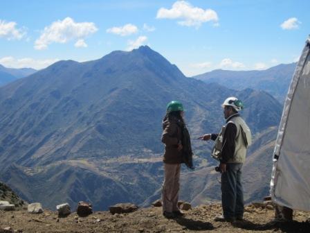 The company's manager of community relations Karina Yavar (left) talks to a geologist at the Bob 1 camp site in Peru.