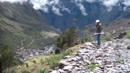 An eastward view towards the Minapampa orebody (centre, in flat, grassy area) at Minera IRL's Ollachea gold project in late 2011. Artisanal miners' structures can be seen at the valley bottom, and hidden even deeper in the valley in the distance is the village of Ollachea. The tunnel portal is in the adjacent valley to the left. Photo by John Cumming