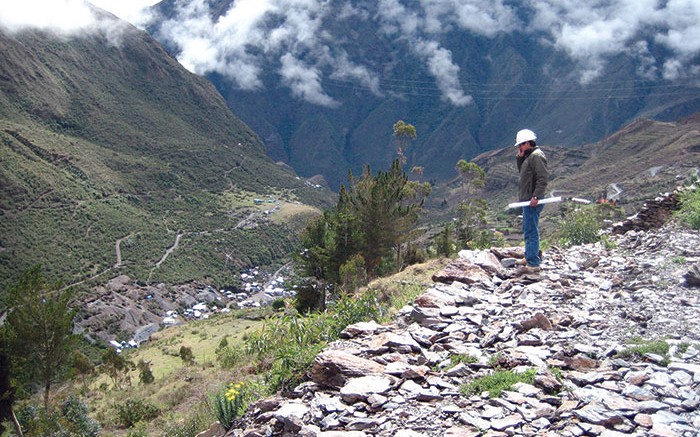 An eastward view towards the Minapampa orebody (centre, in flat, grassy area) at Minera IRL's Ollachea gold project in late 2011. Artisanal miners' structures can be seen at the valley bottom, and hidden even deeper in the valley in the distance is the village of Ollachea. The tunnel portal is in the adjacent valley to the left. Photo by John Cumming