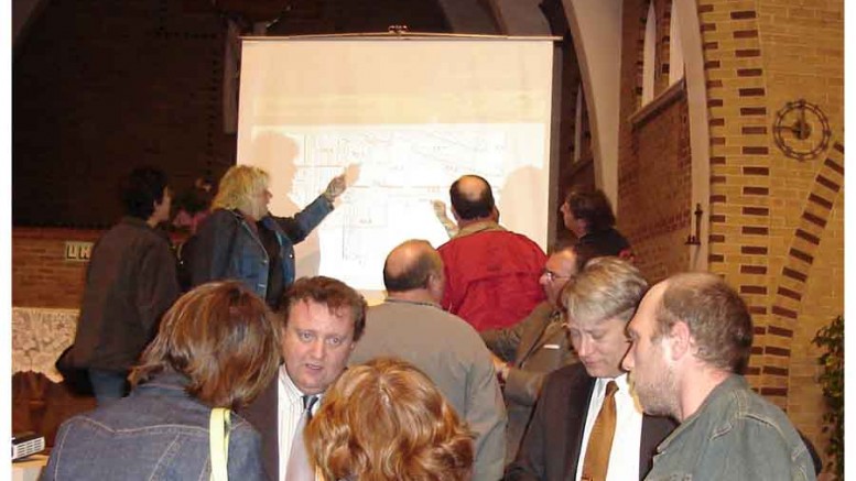 Osisko Mining CEO Sean Roosen (centre) at a community meeting in 2008 in Malartic, Quebec. Osisko achieved commercial production at the Canadian Malartic gold mine in 2011. Source: Osisko Mining