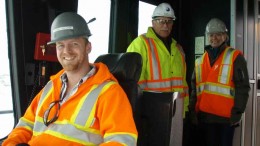 In the cab of an electric shovel at Thompson Creek Metals' Mount Milligan copper-gold project in British Columbia, from left: mine operations general foreman Chris Taylor, construction manager Bert Jeffries and director of corporate responsibility Jocelyn Fraser. Photo by Gwen Preston