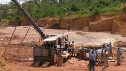 Workers set up equipment at PMI's Obotan project in Ghana. Source: PMI Gold