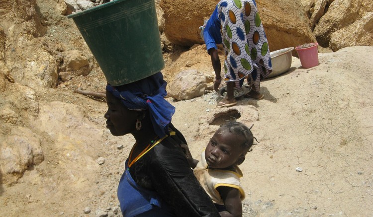 A woman working at Riverstone Resources' (now TrueGold) Karma project in Burkina Faso. Source:  Riverstone Resources