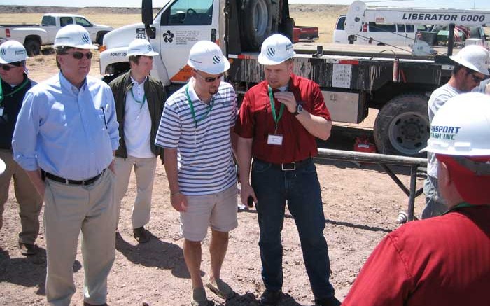 Passport Potash CEO Joshua Bleak (centre) with colleagues at Holbrook. Photo by John Cumming.