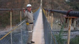 An engineer poses on a suspension bridge at the San Dimas mine. Source: Primero Mining