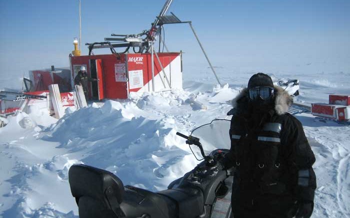 Geologist Nicole Lasanen standing in front of a drill on hole 21, the discovery hole for the Llama Lake Zone. Source: Sabina Gold & Silver