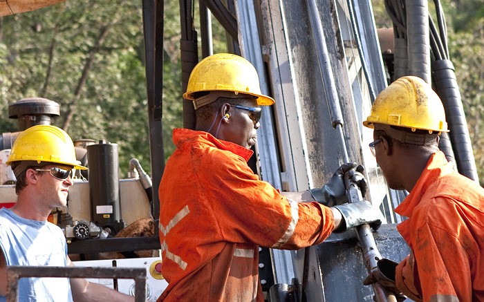 Workers adjust drilling equipment at Amara Mining's  Baomahun project in Sierra Leone (2012). Source: Amara Mining