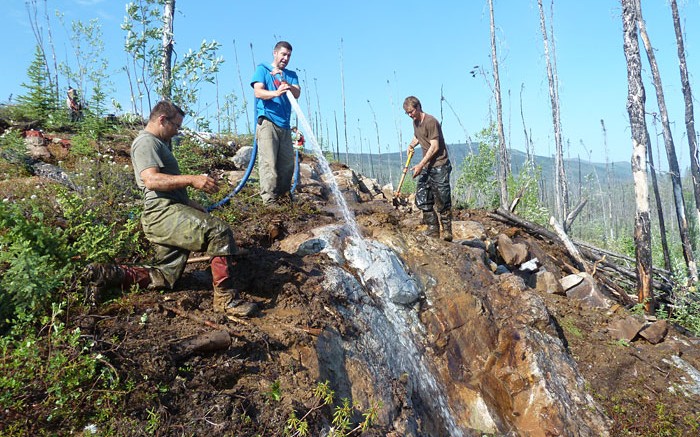 Workers washing a discovery outcrop at Goldstrike Resources' Plateau South gold project in the Yukon. Credit: Goldstrike Resources