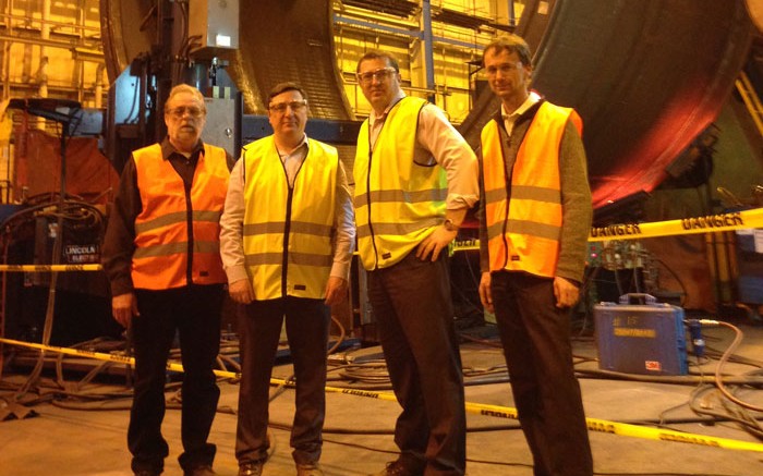 From left: Metso Minerals Canada production manager Andr Bell, Alderon Iron Ore CEO Tayfun Eldem, Alderon COO Brian Penney and Metso manufacturing engineering manager Michel Roy standing in front of a ball mill section to be used at the Kami iron-ore project in the Labrador Trough. Credit: Alderon Iron Ore