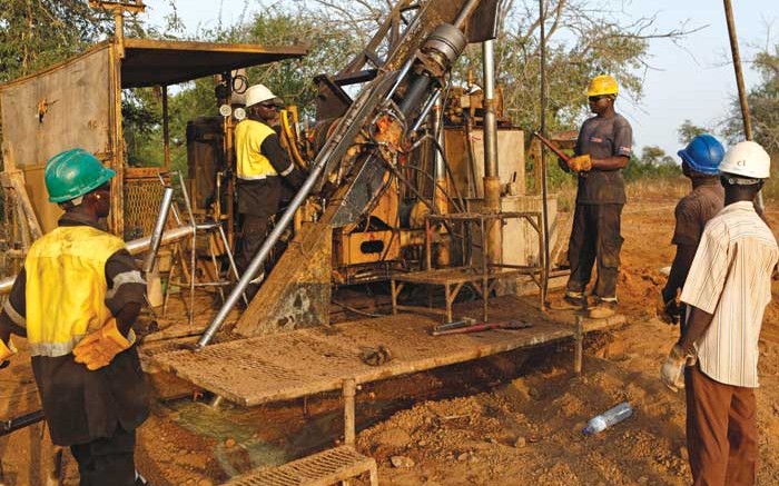 Drillers at Orezone Gold's Bombor gold project in Burkina Faso, where the company is considering a higher-grade heap-leach mining plan. Credit: Orezone Gold