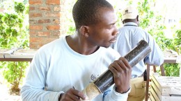A Banro employee examines drill core at the Namoya gold mine in the Democratic Republic of Congo. Credit: Banro